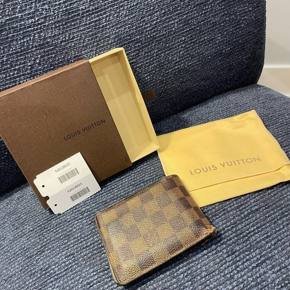 Louis Vuitton Damier Ebene Bifold Wallet in Brown